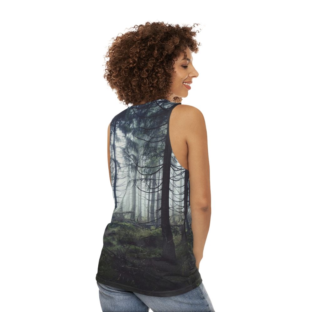 Person wearing unisex nature tank top standing in a forest - women back