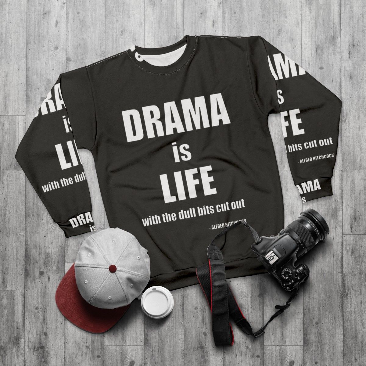 Alfred Hitchcock quote "Drama is life" printed on a navy blue sweatshirt - flat lay