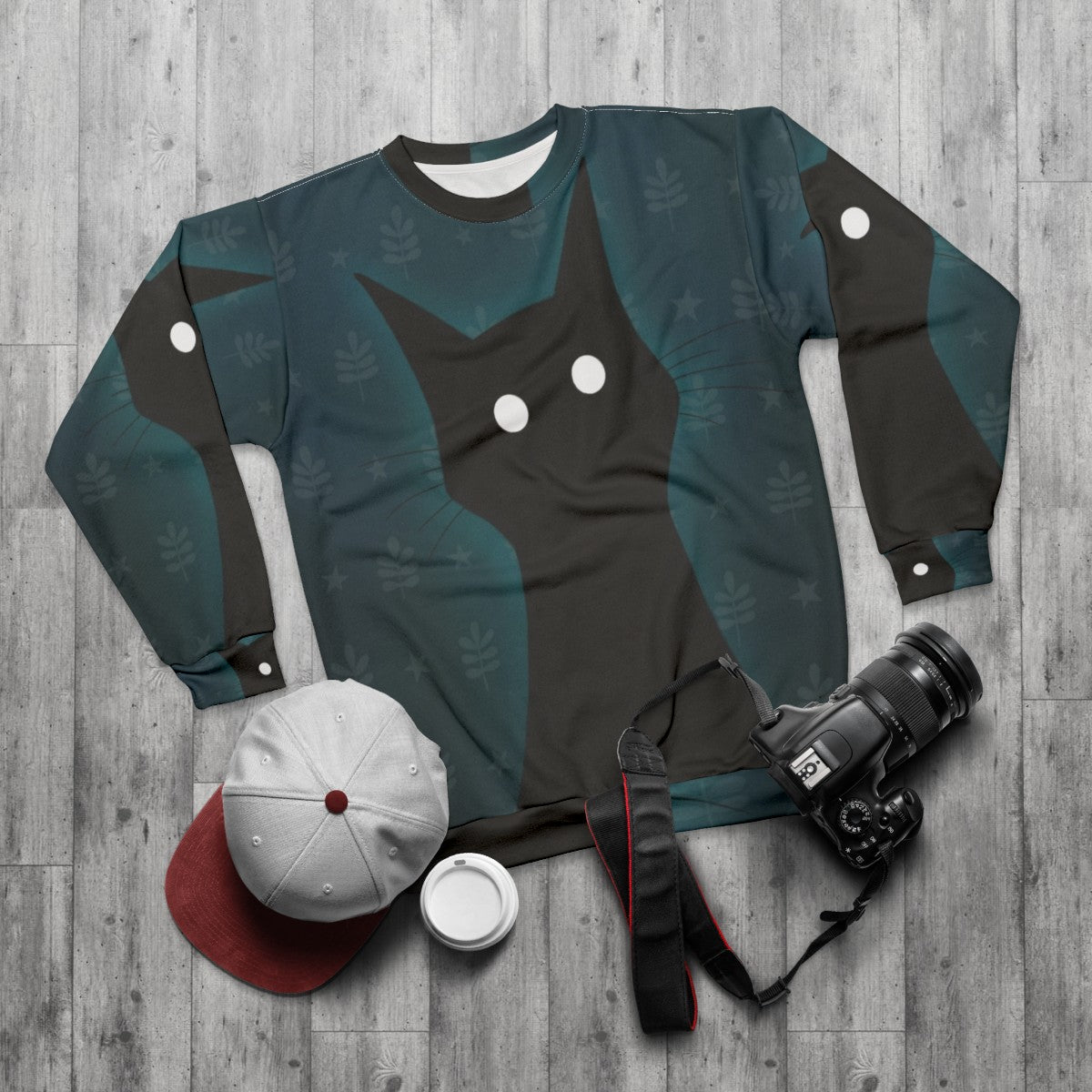 Spooky black cat sweatshirt with illustration - flat lay