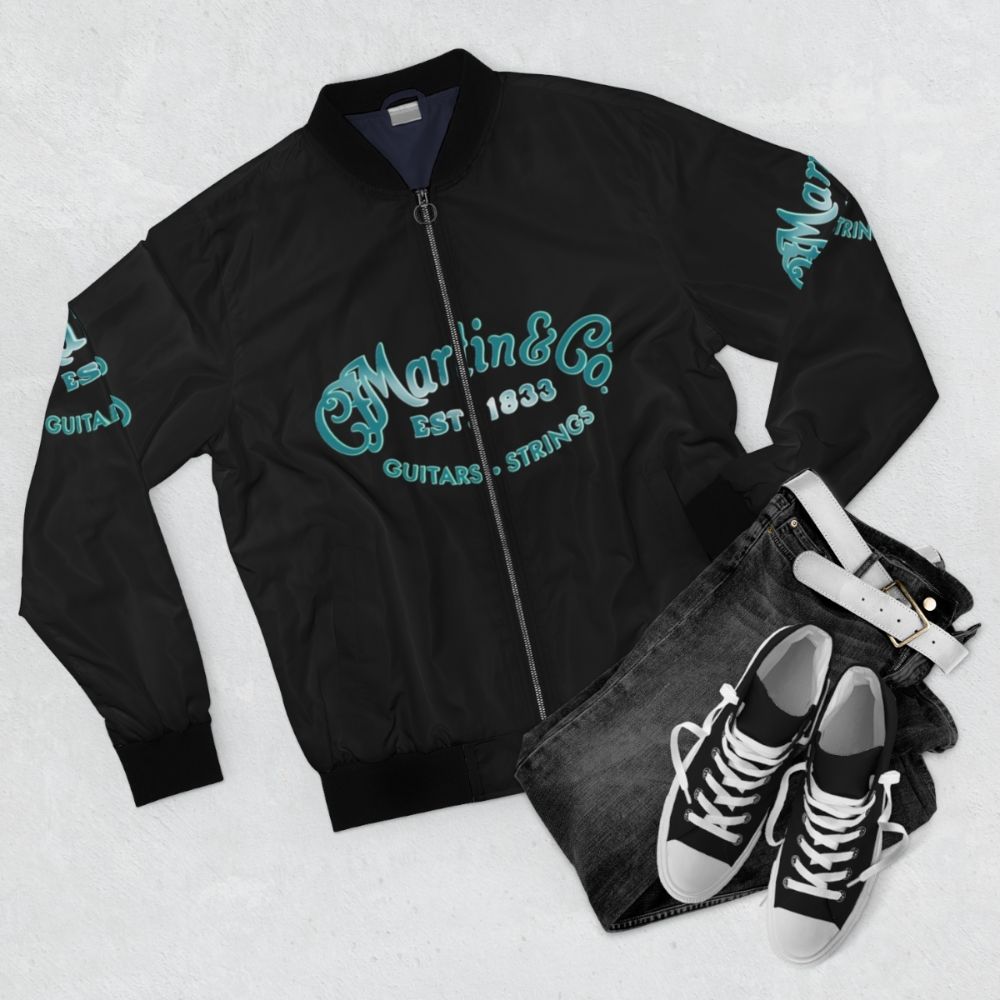 Vintage bomber jacket with a silhouette of a singer or musician holding a microphone - Flat lay