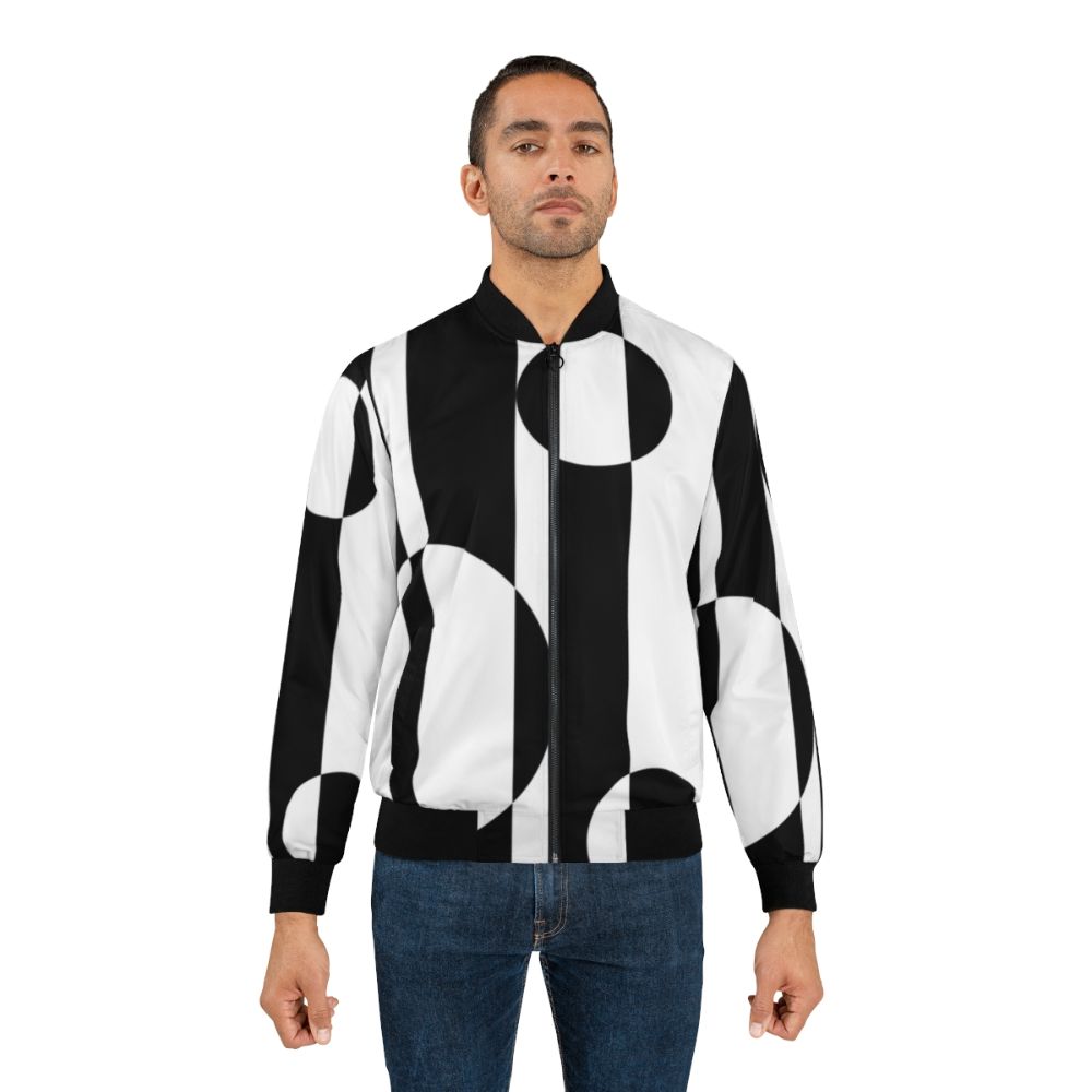 Retro 1960s black and white op art bomber jacket with geometric patterns and color block design - Lifestyle