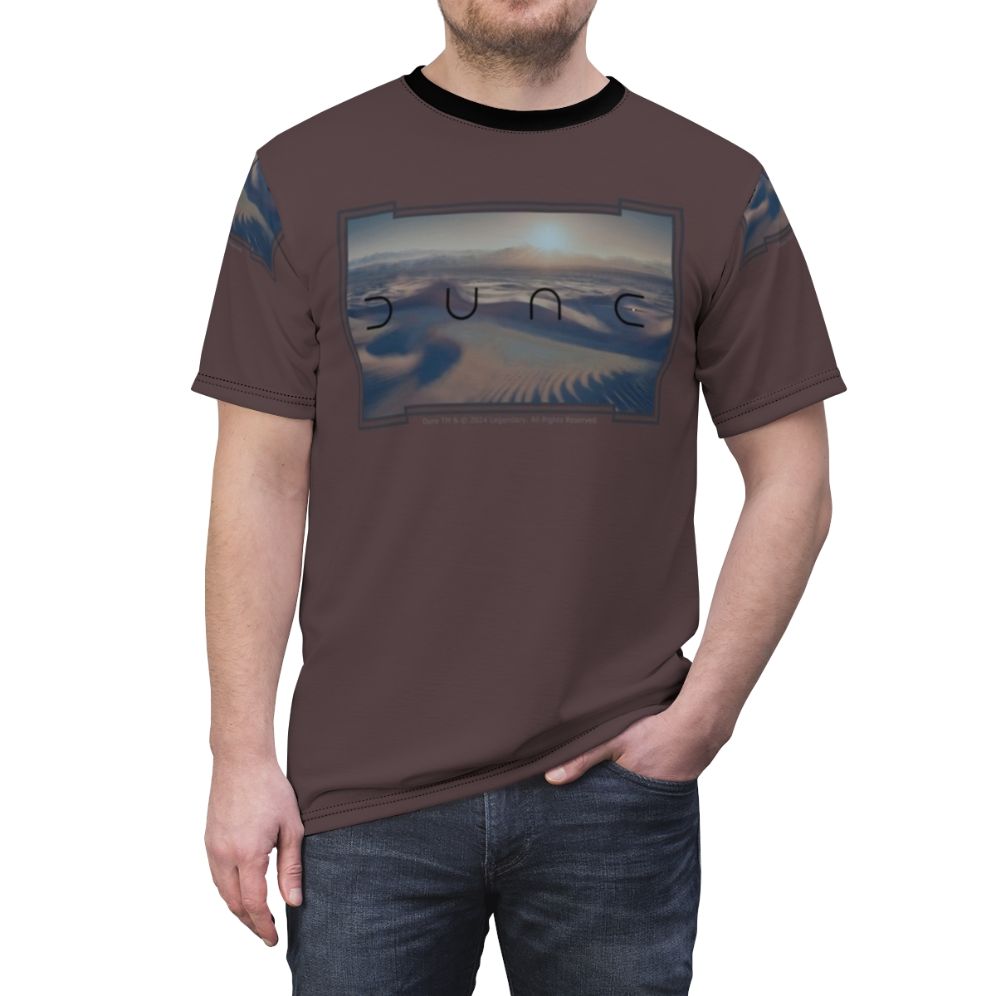 A t-shirt featuring a cinematic design inspired by the sci-fi epic Dune, with a desert landscape and futuristic elements. - men front