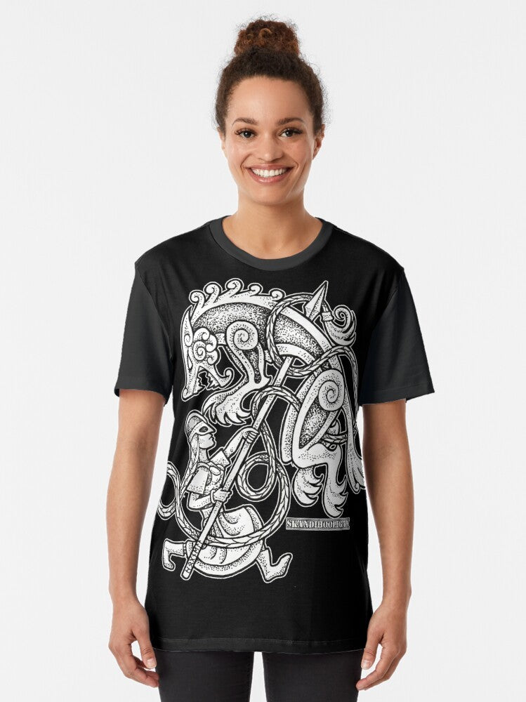 Shieldmaiden huntress graphic t-shirt featuring a fierce female warrior with wolf motifs in a viking/Norse design - Women