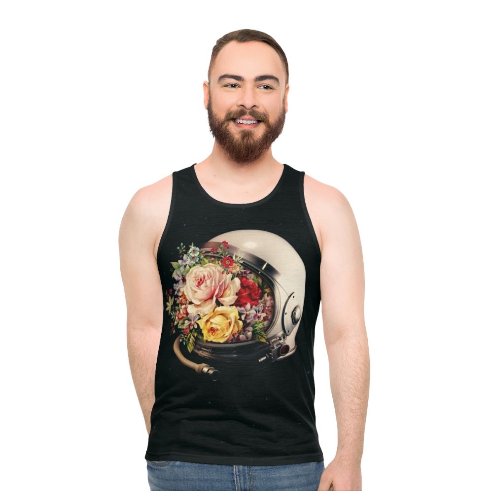 An astronaut in a space suit surrounded by flowers and stars on a cosmic, surreal tank top - men