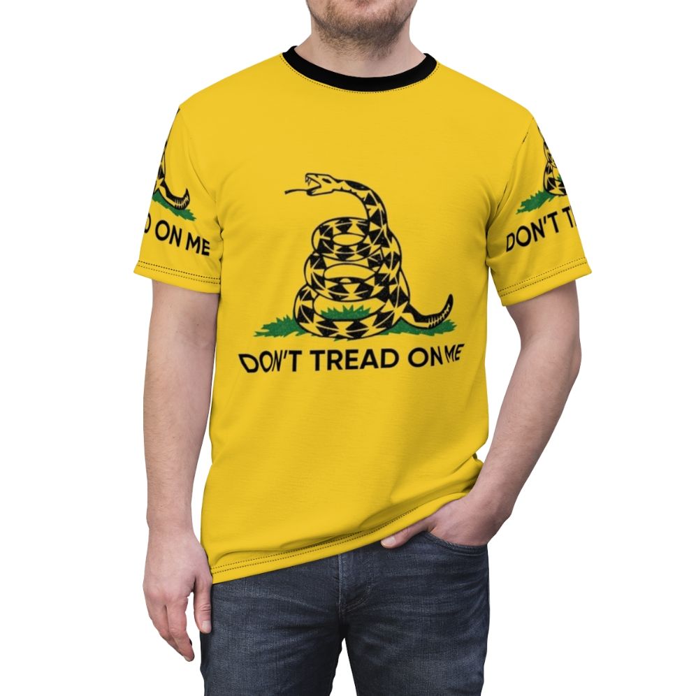 Patriotic "Don't Tread on Me" graphic printed on a high-quality t-shirt. - men front