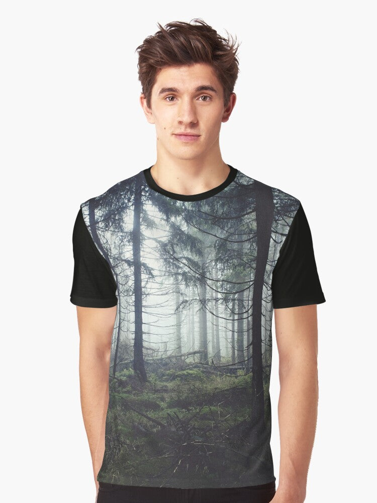 A vintage-inspired graphic t-shirt featuring a misty, foggy forest landscape with trees and mountains, perfect for nature and adventure lovers. - Men