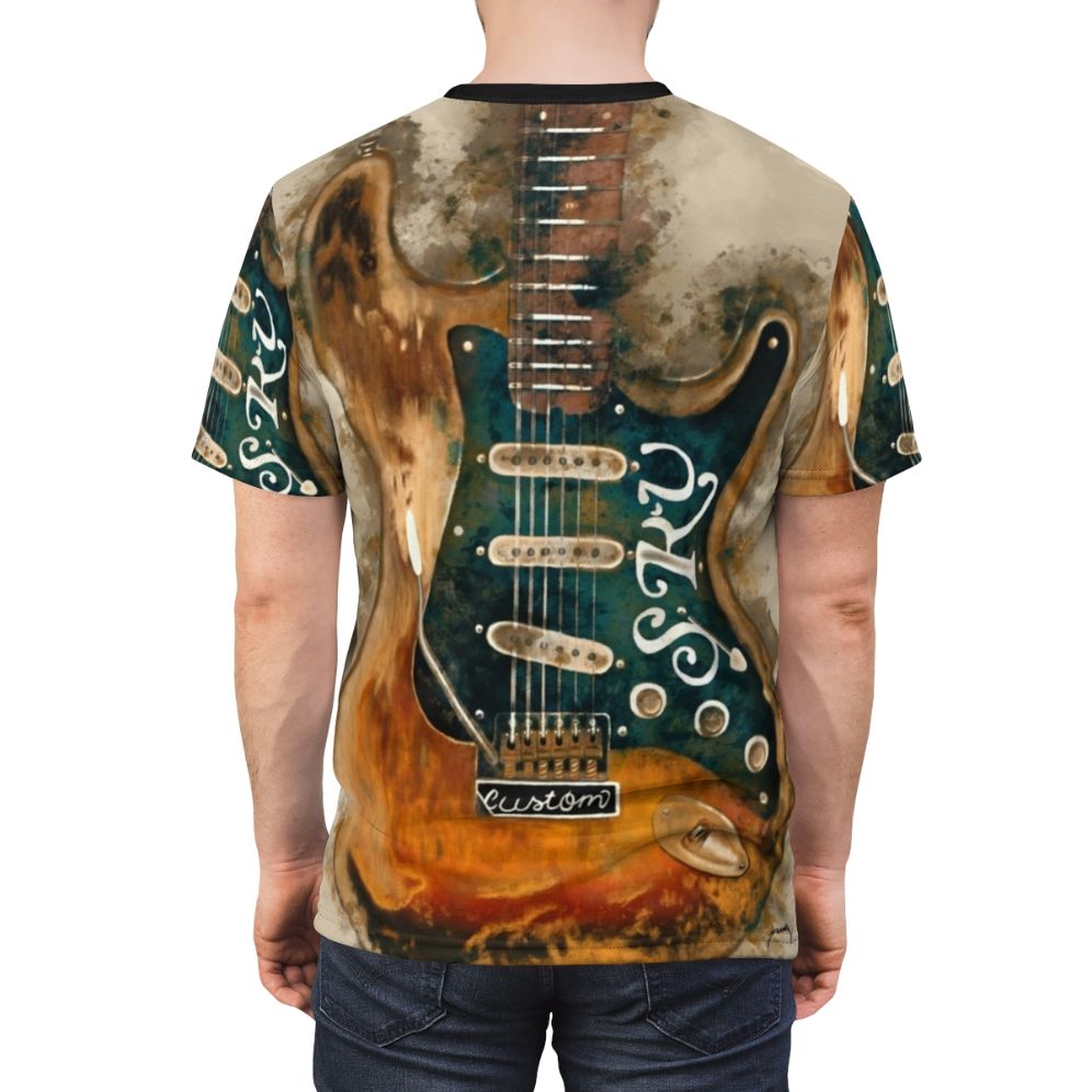 A stylized t-shirt design featuring an electric guitar with a watercolor effect, inspired by the legendary blues guitarist Stevie Ray Vaughan. - men back