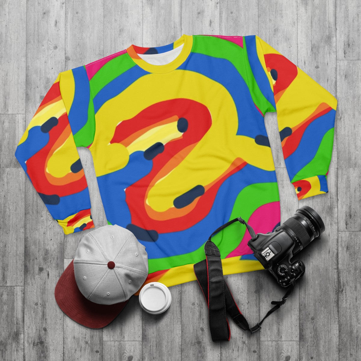 Colorful graphic sweatshirt with various patterns and designs - flat lay