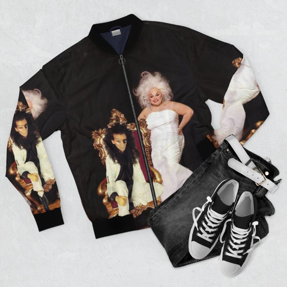 Vintage bomber jacket with images of Pete Burns and Divine, iconic 80s music stars - Flat lay