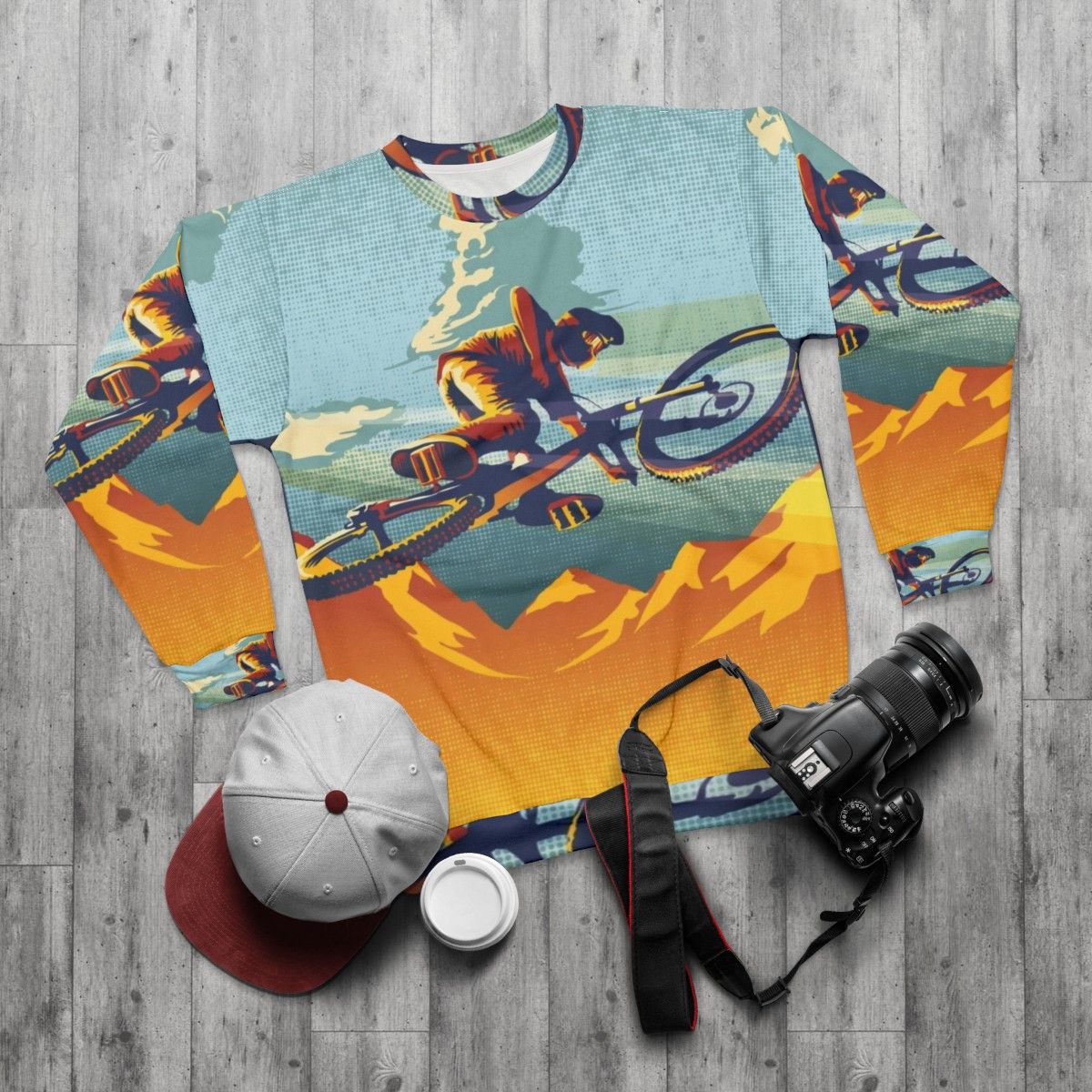 Mountain biking inspired sweatshirt with cycling art and design - flat lay