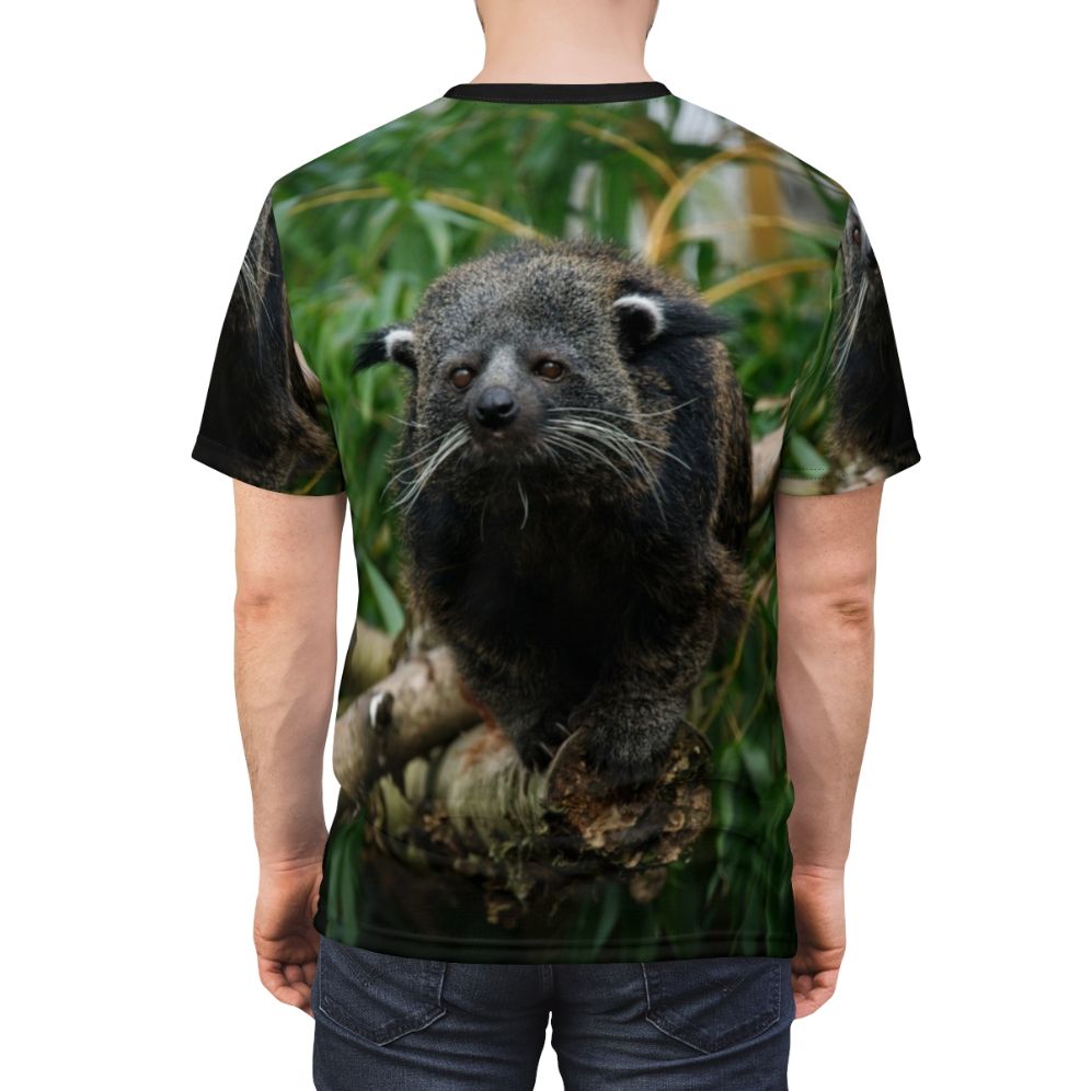 Photograph of a Binturong, also known as a Bearcat, wearing a custom t-shirt with a binturong-themed graphic. - men back