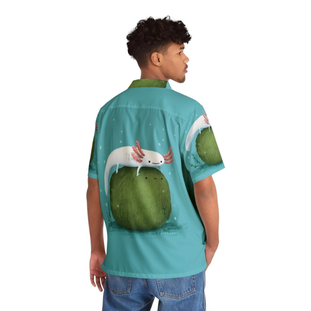 Axolotl sitting on a mossball, featured on a vibrant Hawaiian shirt - Flat lay