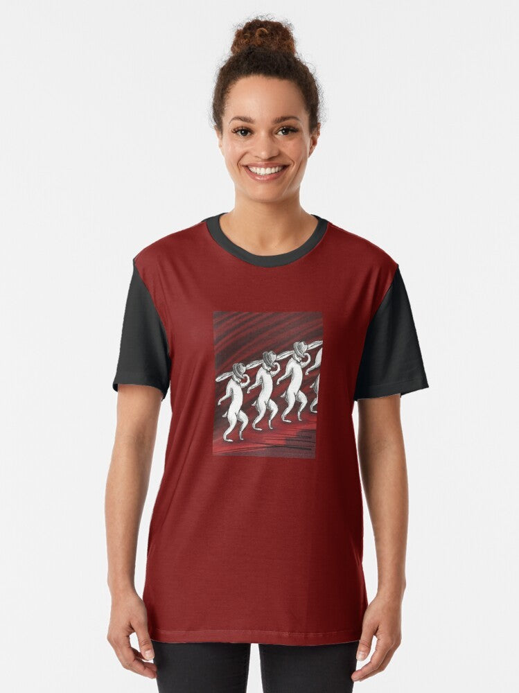 A graphic t-shirt featuring a receding hare line design with a rabbit or bunny wearing a fedora and doing the moonwalk. - Women