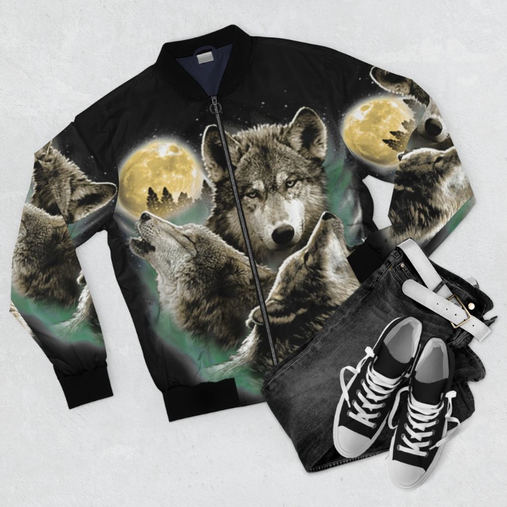 A bomber jacket featuring a design of three wolves howling at the full moon in a natural, wilderness setting. - Flat lay