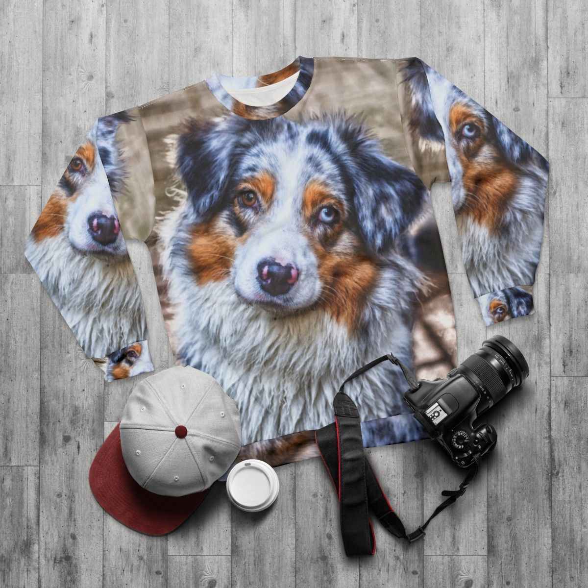 Australian Shepherd breed sweatshirt with blue merle and brown eye design - flat lay