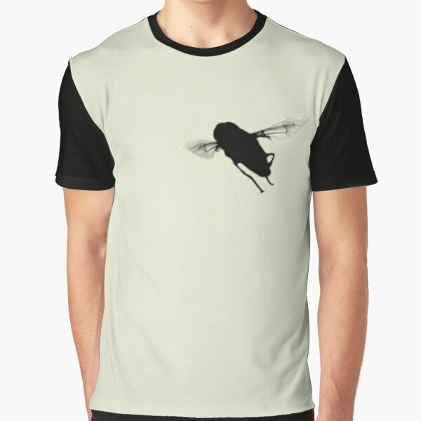 A minimalist silhouette design of a hover fly or syrphid fly on a black and cream t-shirt.