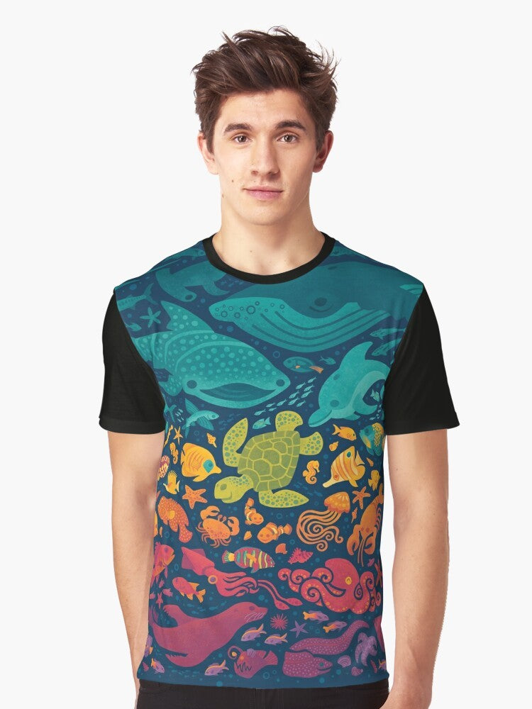 Colorful graphic t-shirt featuring a vibrant aquatic spectrum design with various sea creatures and marine life. - Men