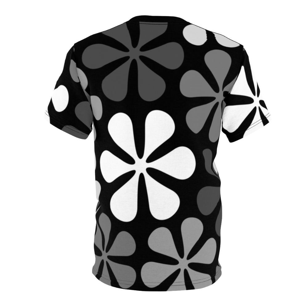 Model wearing a black and white abstract floral design t-shirt - Back