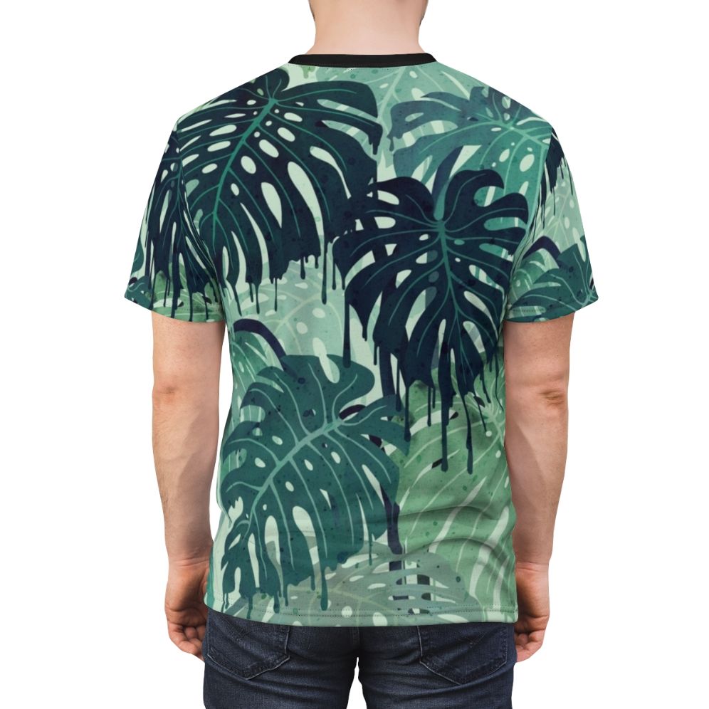 Closeup of a vibrant, tropical monstera leaf print on a t-shirt - men back