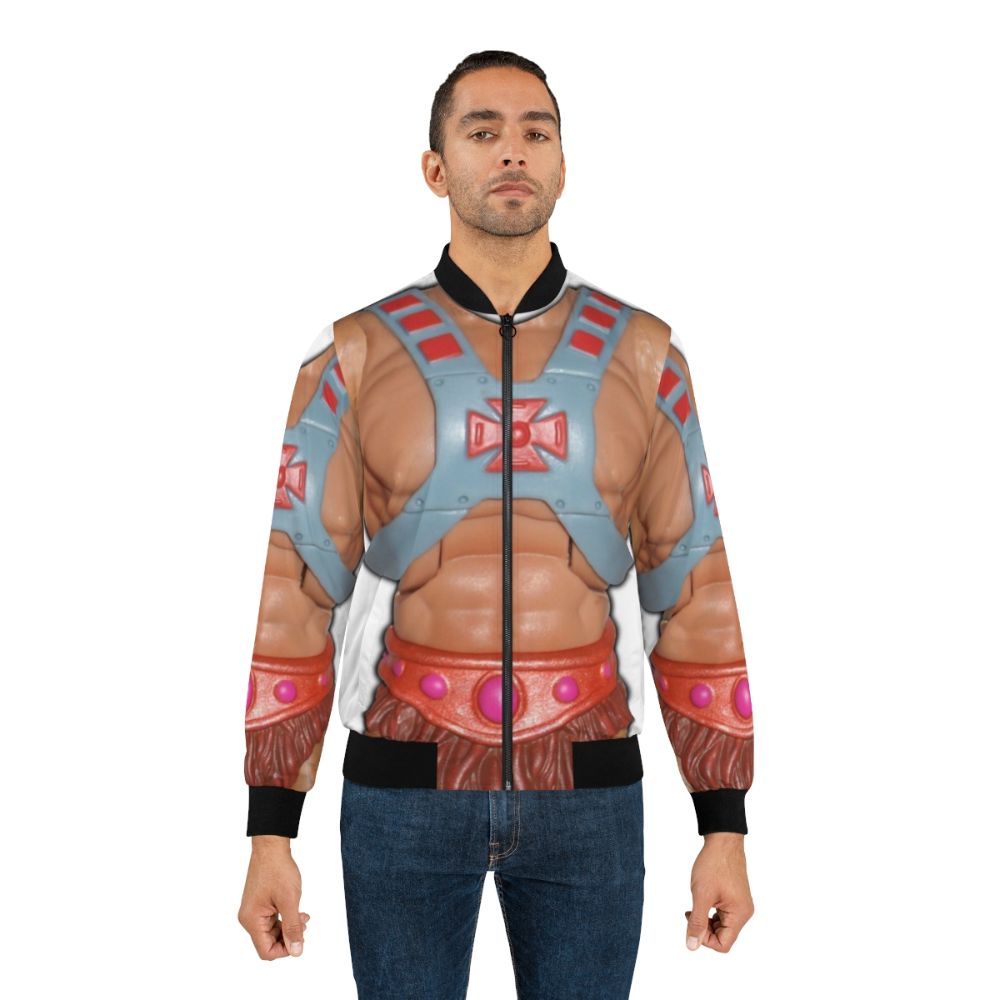 Vintage-style bomber jacket with a retro He-Man action figure graphic - Lifestyle