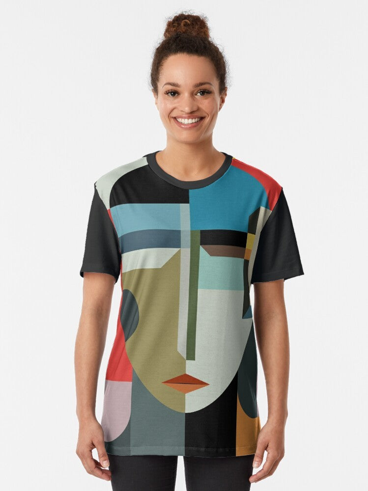 Modernist graphic t-shirt featuring an abstract, surreal woman's face with a timeless, mysterious design. - Women