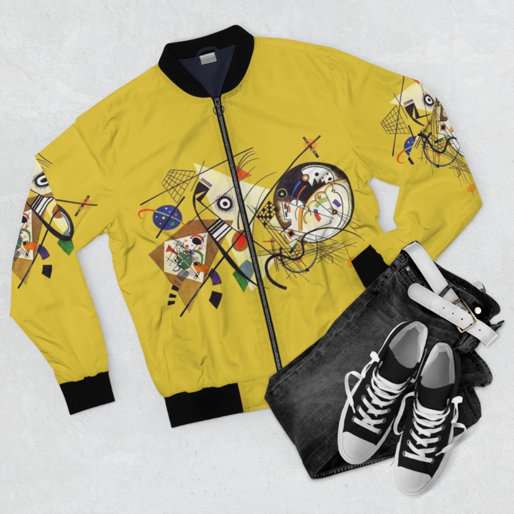 Bomber jacket featuring Wassily Kandinsky's abstract art painting "Transverse Lines (1923)" - Flat lay