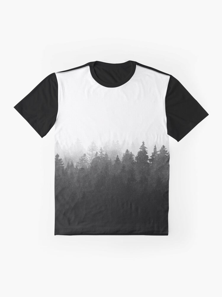 Graphic t-shirt featuring a wilderness landscape with trees, fog, and mountains - Flat lay