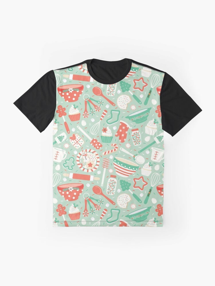 A vibrant graphic t-shirt featuring various Christmas baking elements like cookies, cupcakes, and candy canes. - Flat lay