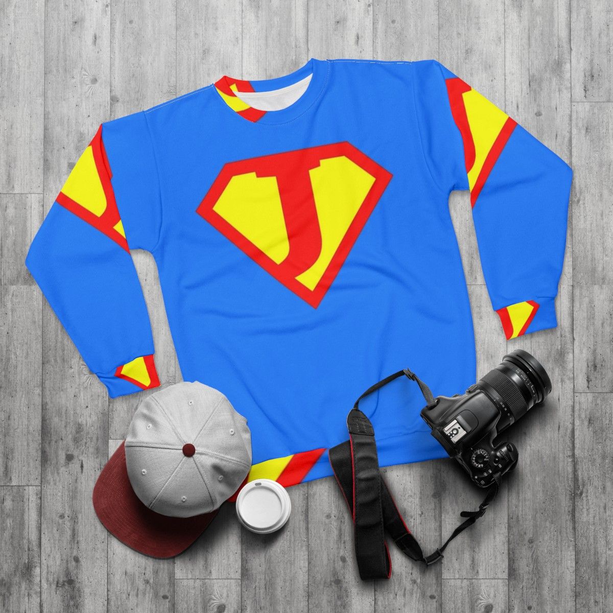 Letter J Sweatshirt with Superhero Graphic Design - flat lay