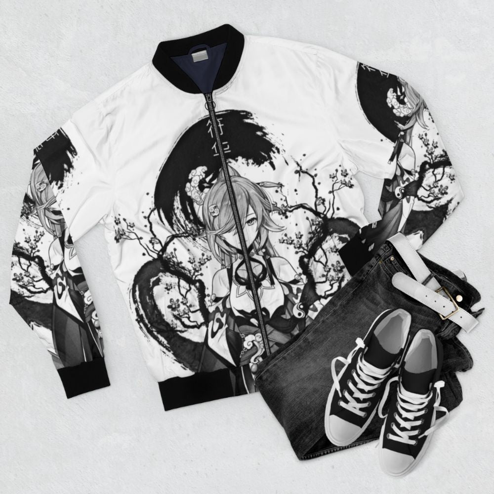 Monochrome bomber jacket with fantasy and anime-inspired designs, including elements from Honkai Impact and Genshin Impact. - Flat lay