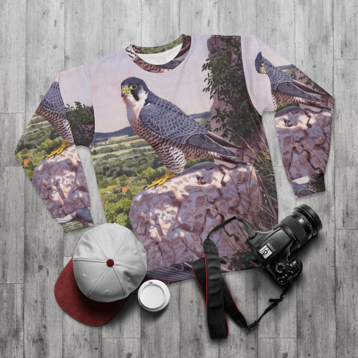 Peregrine falcon inspired sweatshirt with bird art - flat lay