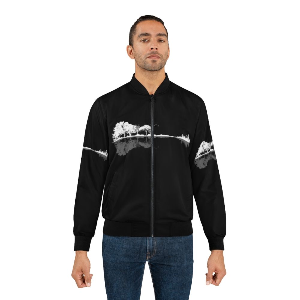 A black and white bomber jacket with a nature and guitar design for music lovers. - Lifestyle