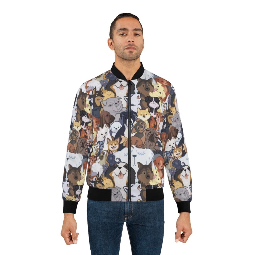 A bomber jacket featuring a vibrant, cartoon-style pattern of various dog breeds, including golden retrievers, pugs, and corgis, against a colorful background. - Lifestyle