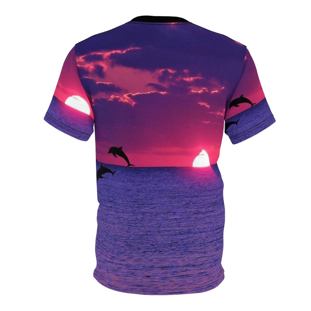 Stunning AOP t-shirt featuring a vibrant sunset sky with pink and purple hues, including a dolphin silhouette on the horizon. - Back