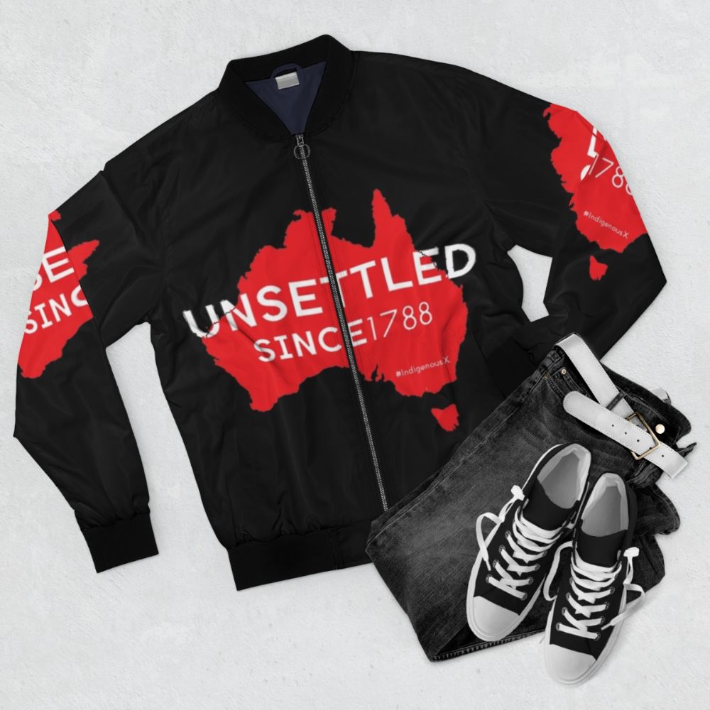 Unsettled Since 1788 (Red) Bomber Jacket, featuring indigenous Australian design - Flat lay