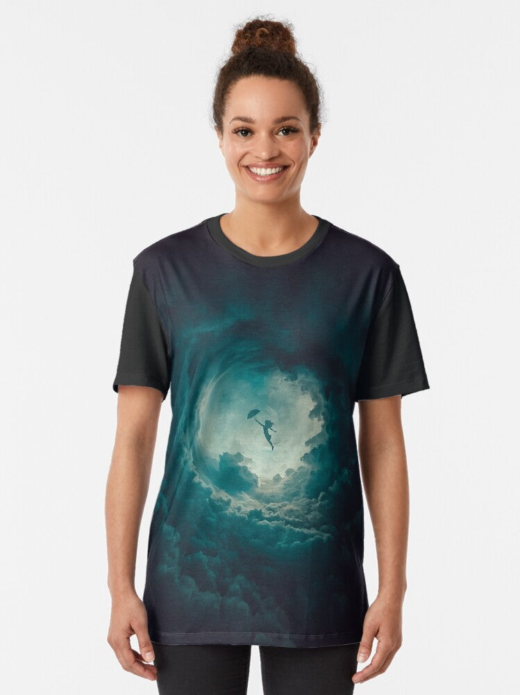 A green graphic t-shirt featuring a round design with clouds, sky, and an umbrella in a mixed media style. - Women