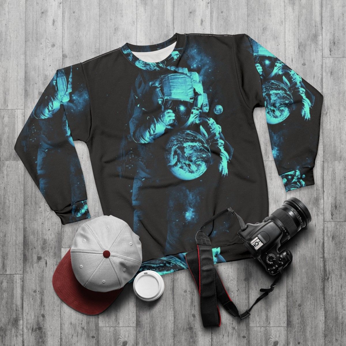 Cosmic intergalactic sweatshirt featuring surreal outer space design - flat lay