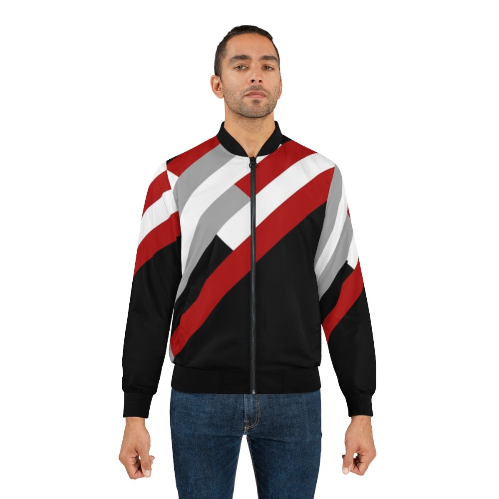 A minimalist bomber jacket with a diagonal stripes pattern in grey, red, and white colors. - Lifestyle