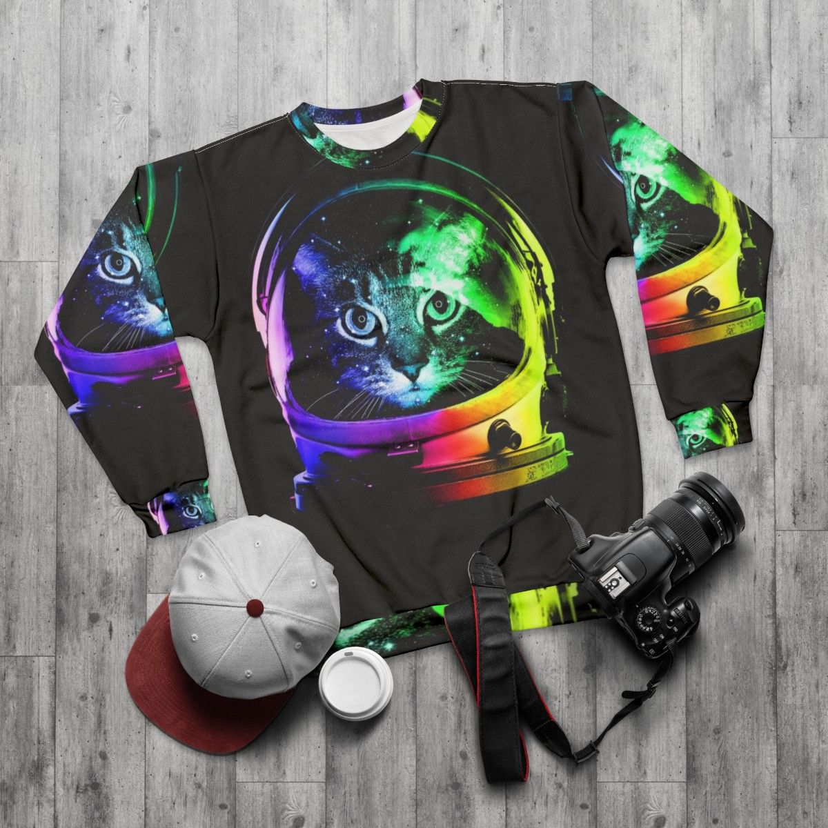 Astronaut cat in a space-themed sweatshirt - flat lay