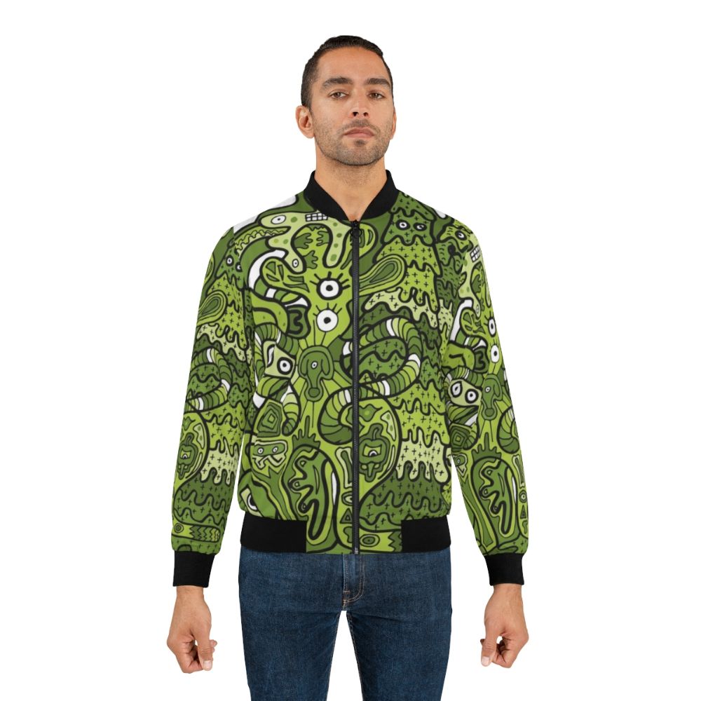 A vibrant bomber jacket featuring a doodle of a bouncing squid-like creature in various colors. - Lifestyle