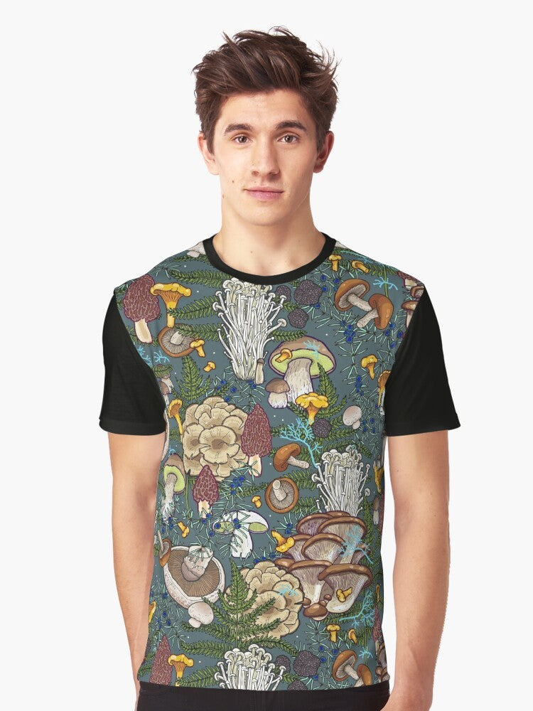 Graphic t-shirt featuring a pattern of various mushrooms in a forest setting, including chanterelle, portobello, bolete, oyster, truffle, and more. - Men