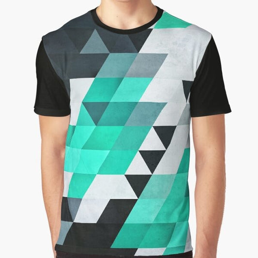 A modern, geometric abstract pattern t-shirt in teal, white, and black colors.
