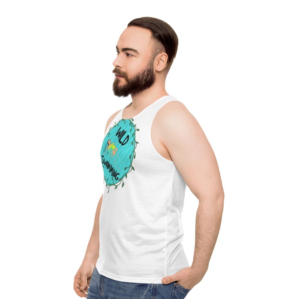 Model wearing the Wild Swimming Unisex Tank Top in a natural outdoor setting - men side