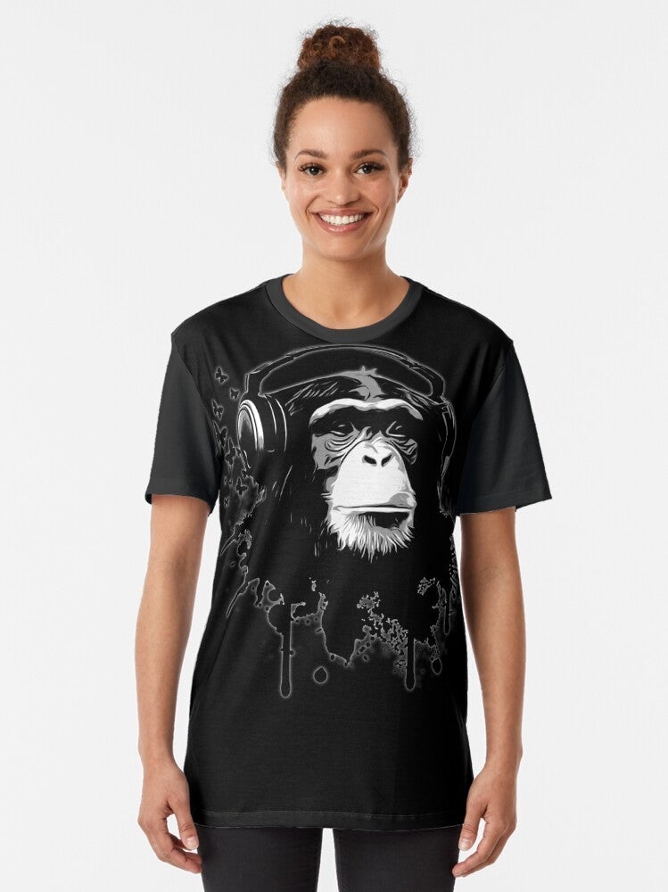 A black t-shirt featuring a cool monkey/chimpanzee graphic in an urban graffiti-style design. - Women