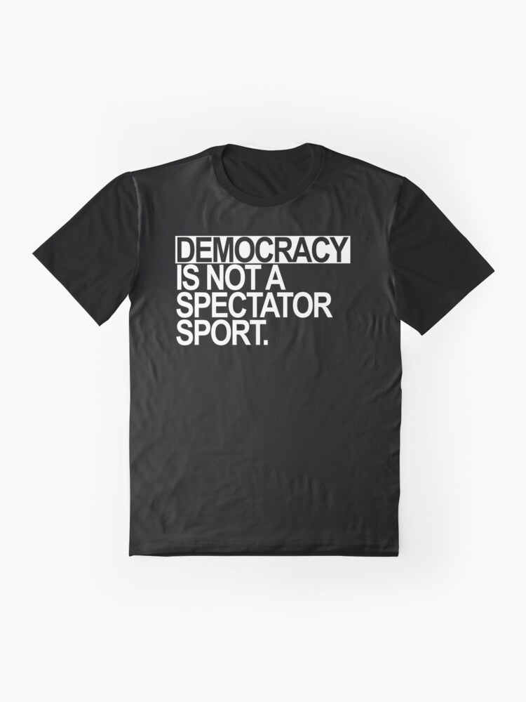 A white t-shirt with the text "Democracy is NOT a Spectator Sport" in bold, black letters. - Flat lay