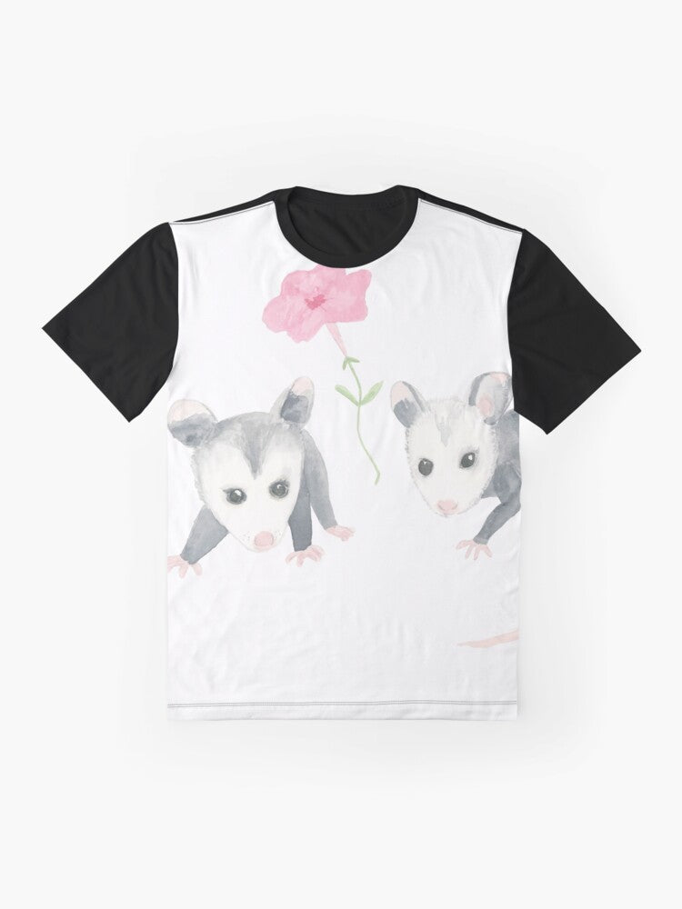 Adorable illustration of a baby opossum surrounded by pink petunias on a graphic t-shirt - Flat lay