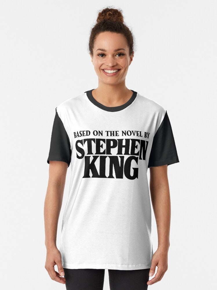 A graphic t-shirt featuring a design inspired by Stephen King's "The Dark Tower" book series. - Women