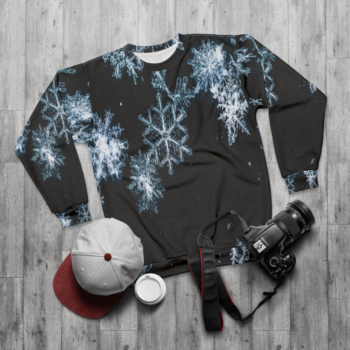 Black and white snowflake pattern sweatshirt - flat lay