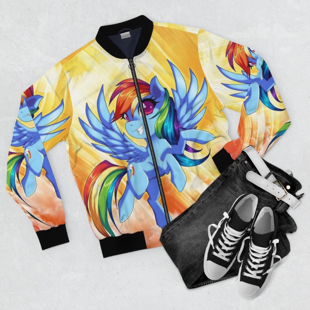 A black bomber jacket with a colorful Rainbow Dash design, inspired by the My Little Pony character. - Flat lay