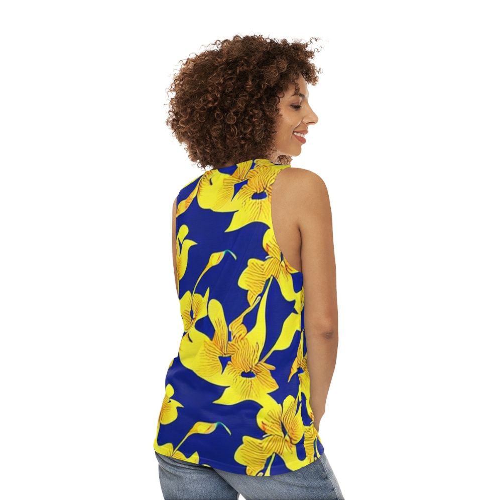 Abstract yellow floral pattern on blue unisex tank top - women back